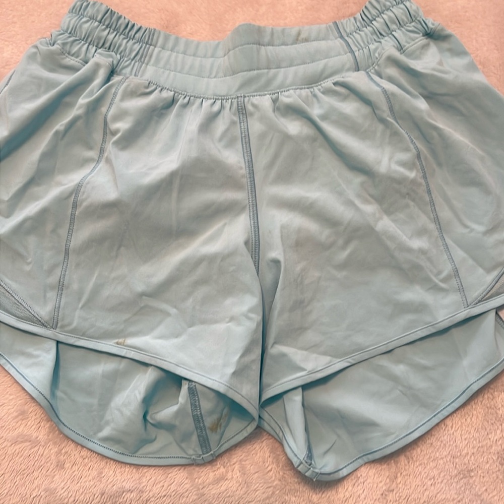 Lululemon blue shorts size 6 Tall. Small stain on the bottom under leg area.